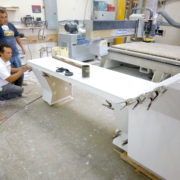 Raul and Manuel fitting pieces on a custom reception desk